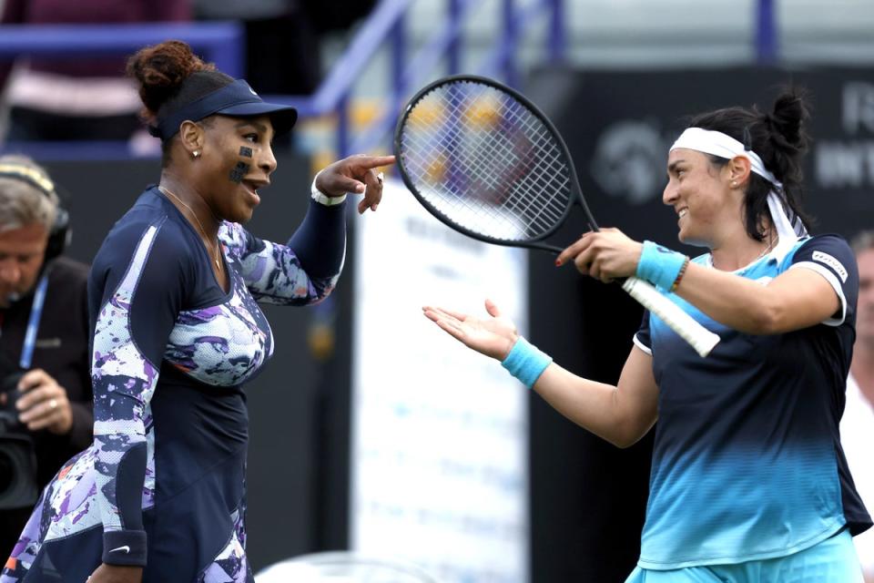 Serena Williams celebrates with team-mate Ons Jabeur (PA Wire)