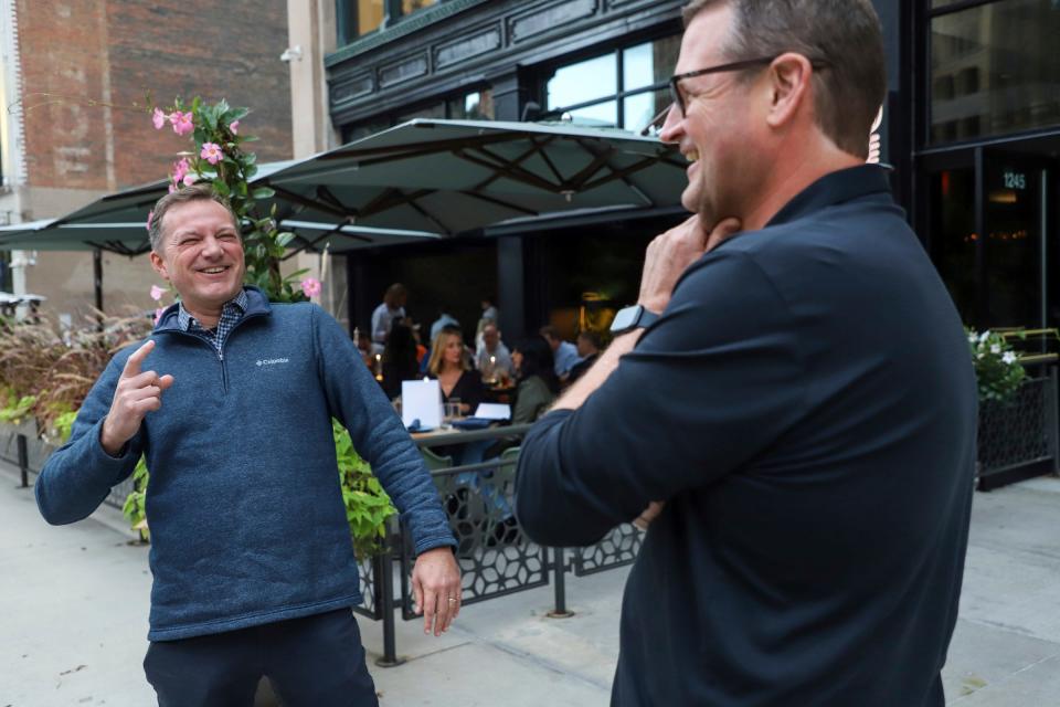 Don Brown, 56, of Beverly Hills, (right) and Eric Shreffler, 53, of Beverly Hills walk into Leila to meet their wives for dinner in downtown Detroit on Sept. 29, 2023.