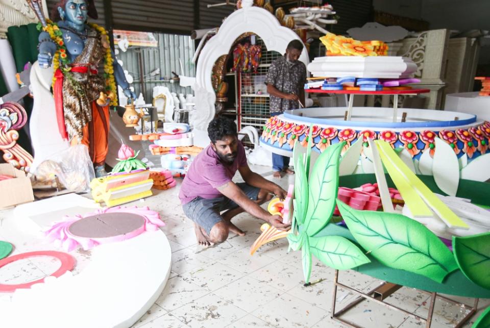 Kavadi maker, Nadarajah Palani, and his assistant Lawrence Dev Jothee Paragasam at their workshop in Taman Rishah, Ipoh. 