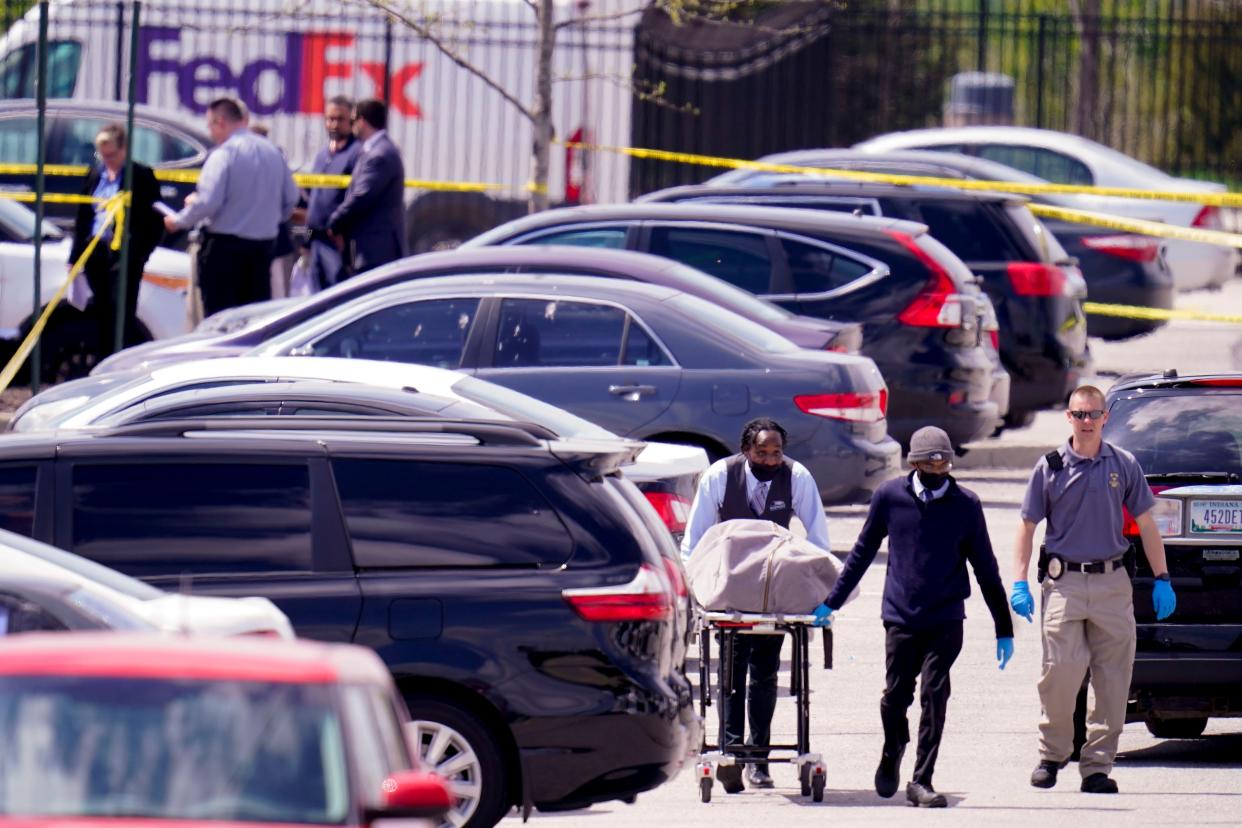 A body is taken from the scene where multiple people were shot at a FedEx Ground facility in Indianapolis, Friday, April 16, 2021.