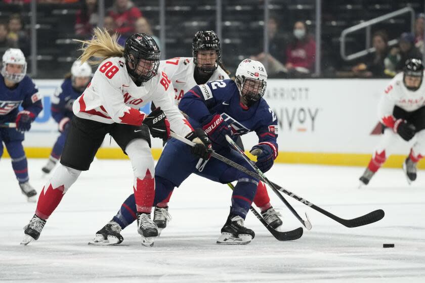 Canada forward Julia Gosling (88) and defender Ella Shelton (17) defend against United States.