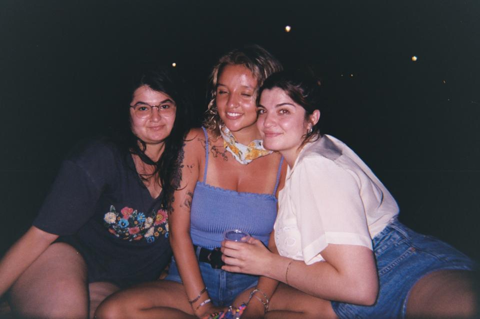 three girls pose for a photo