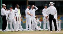 Cricket - Sri Lanka v South Africa -Second Test Match - Colombo, Sri Lanka - July 20, 2018 - South Africa's captain Faf du Plessis, Kagiso Rabada and Dale Steyn react next to their teammates after the third umpire decision for the unsuccesful LBW wicket for Sri Lanka's Danushka Gunathilaka (not pictured). REUTERS/Dinuka Liyanawatte