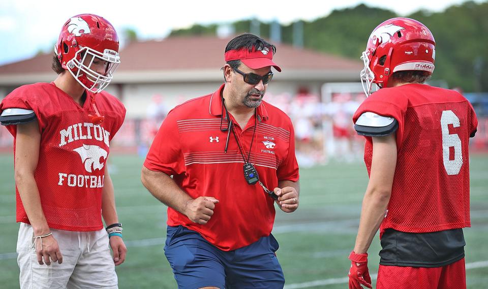 Coach Steve Dembowski works with his prospects. The Milton High Wildcats football team practices for the new season on Wednesday August 24, 2022.