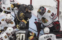 Vegas Golden Knights' William Karlsson (71) is stopped by Chicago Blackhawks goalie Corey Crawford (50) during the second period of an NHL hockey Stanley Cup first-round playoff series, Thursday, Aug. 13, 2020, in Edmonton, Alberta. (Jason Franson/The Canadian Press via AP)