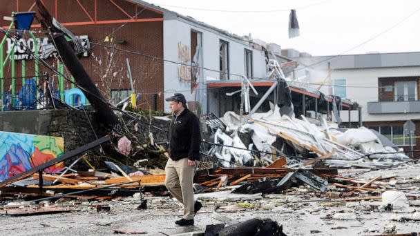 PHOTO: A man walks past storm debris following a deadly tornado, March 3, 2020, in Nashville, Tenn. (Mark Humphrey/AP)