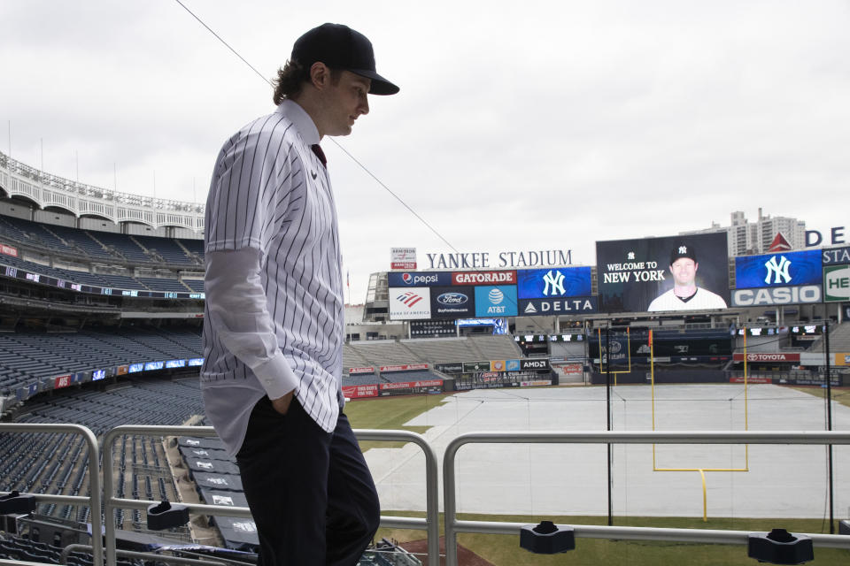 Gerrit Cole poses at Yankee Stadium as the newest New York Yankees player is introduced during a baseball media availability, Wednesday, Dec. 18, 2019 in New York. The pitcher agreed to a 9-year $324 million contract. (AP Photo/Mark Lennihan)