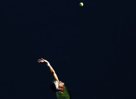 Tennis - Australian Open - Rod Laver Arena, Melbourne, Australia, January 17, 2018. Leonardo Mayer of Argentina serves against Rafael Nadal of Spain. REUTERS/Issei Kato