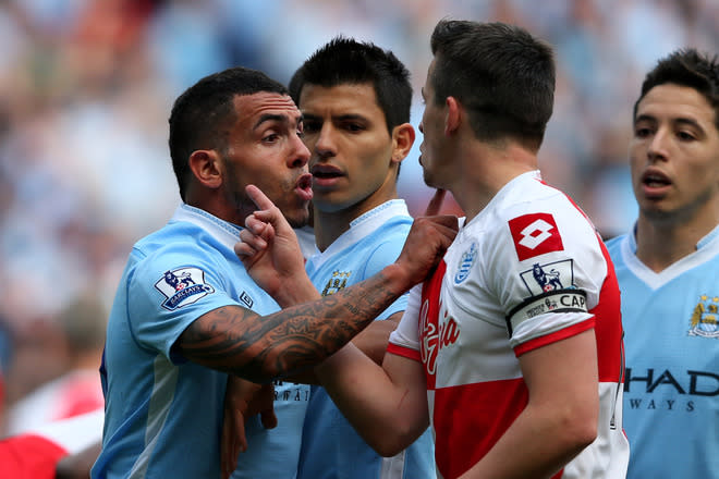 MANCHESTER, ENGLAND - MAY 13: Carlos Tevez of Manchester City clashes with Joey Barton of QPR after being fouled during the Barclays Premier League match between Manchester City and Queens Park Rangers at the Etihad Stadium on May 13, 2012 in Manchester, England. (Photo by Alex Livesey/Getty Images)