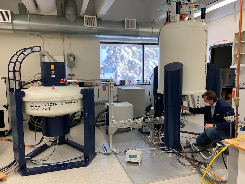 Chemistry professor Vlad Michaelis inspects instruments with superconducting magnets at the University of Alberta.