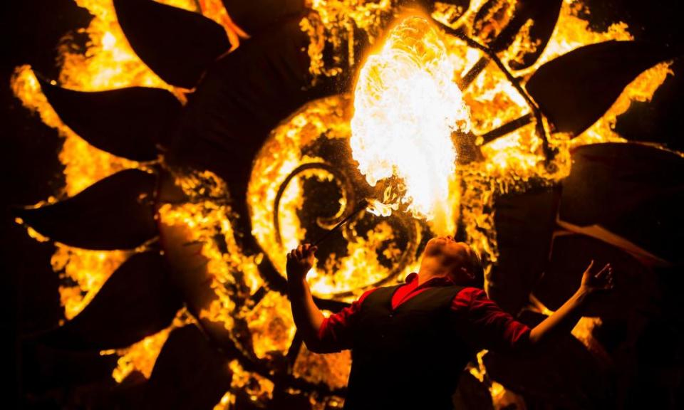 Toronto, Canada. 2 Dec, 2019. A performer plays with fire at the 2019 Kensington Market Winter Solstice Festival