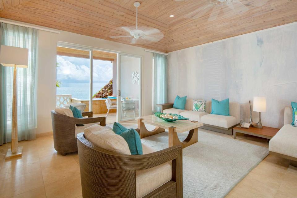 A guest room sitting space at Curtain Bluff