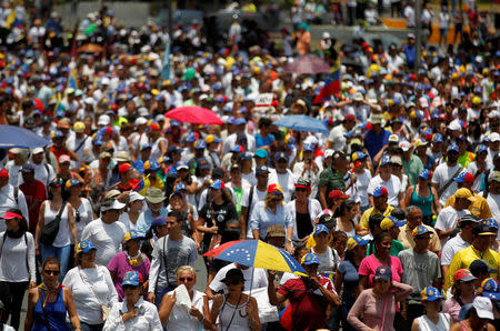 Opposition demonstrators rally against Venezuela's President Nicolas Maduro in Caracas, Venezuela, April 20, 2017. REUTERS/Christian Veron