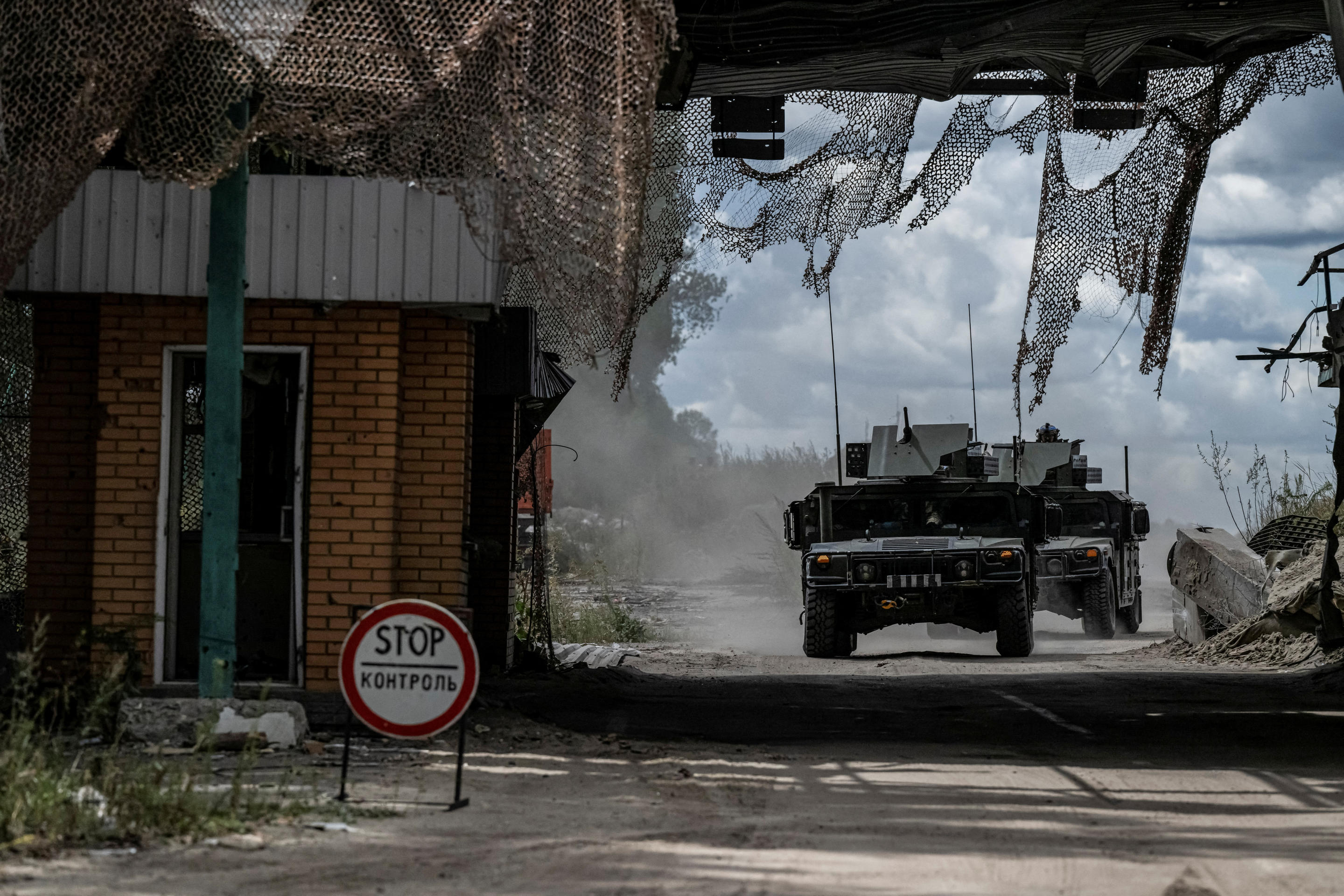 Ukrainian servicemen ride military vehicles from a crossing point at the border with Russia, amid Russia's attack on Ukraine, in Sumy region, Ukraine August 13, 2024. (Viacheslav Ratynskyi/Reuters)