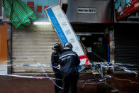 <p>Police deal with a damaged light board as typhoon Hato hits Hong Kong on Aug. 23, 2017 in Hong Kong. (Photo: Billy H.C. Kwok/Getty Images) </p>