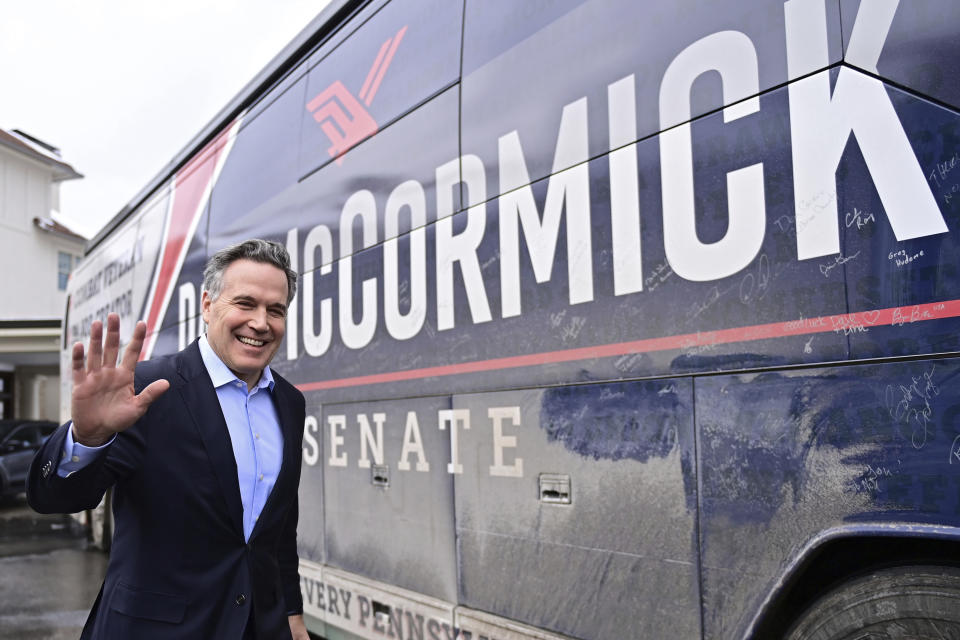 David McCormick, a Republican candidate for U.S. Senate in Pennsylvania, prepares to enter his campaign bus after a a campaign stop in Erie, Pa. on Saturday, Feb. 17, 2024. (AP Photo/David Dermer)