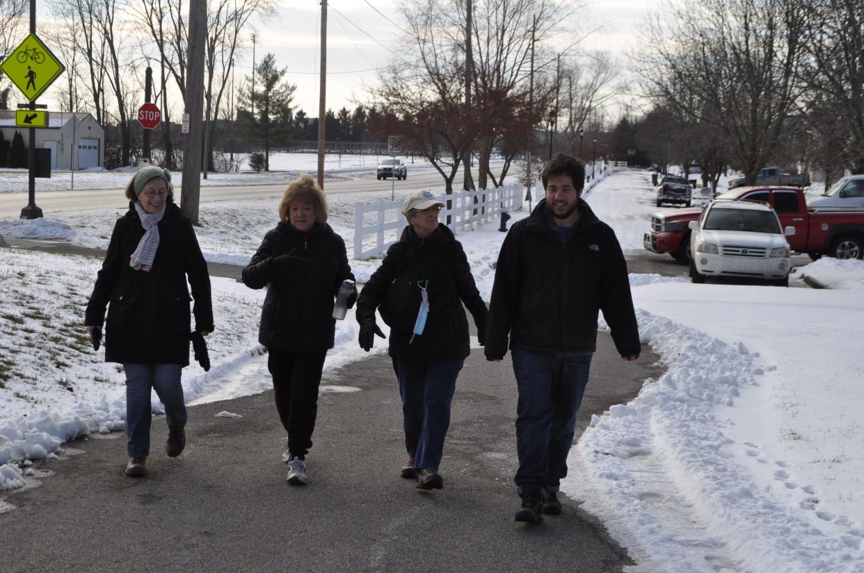 (From left) Donna Olenhouse, Karen Mustard and Bonnie LaFleur, all of Hilliard, enjoy a Jan. 19 walk on the Heritage Rail Trail in Hilliard. They were joined by Tristian Sutton-Jennings (right) of the Hilliard Recreation and Parks Department.