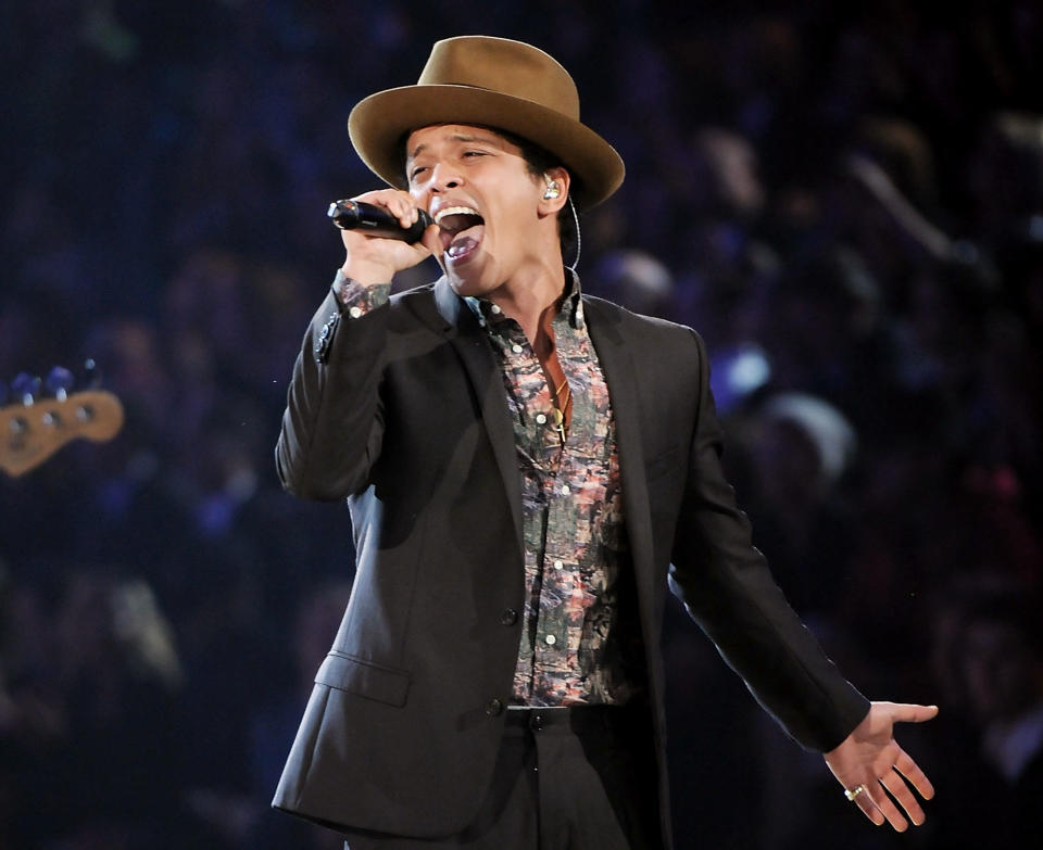 FILE - This Nov. 7, 2012 file photo shows Bruno Mars performing during the 2012 Victoria's Secret Fashion Show in New York. Mars is releasing his sophomore album, “Unorthodox Jukebox," featuring Grammy-winning jazz singer Esperanza Spalding and production and songwriting work by Mark Ronson, Jeff Bhasker, Diplo, Paul Epworth, Emile Haynie and the Smeezingtons, the production trio that includes Mars, Philip Lawrence and Ari Levine. (Photo by Evan Agostini/Invision/AP)