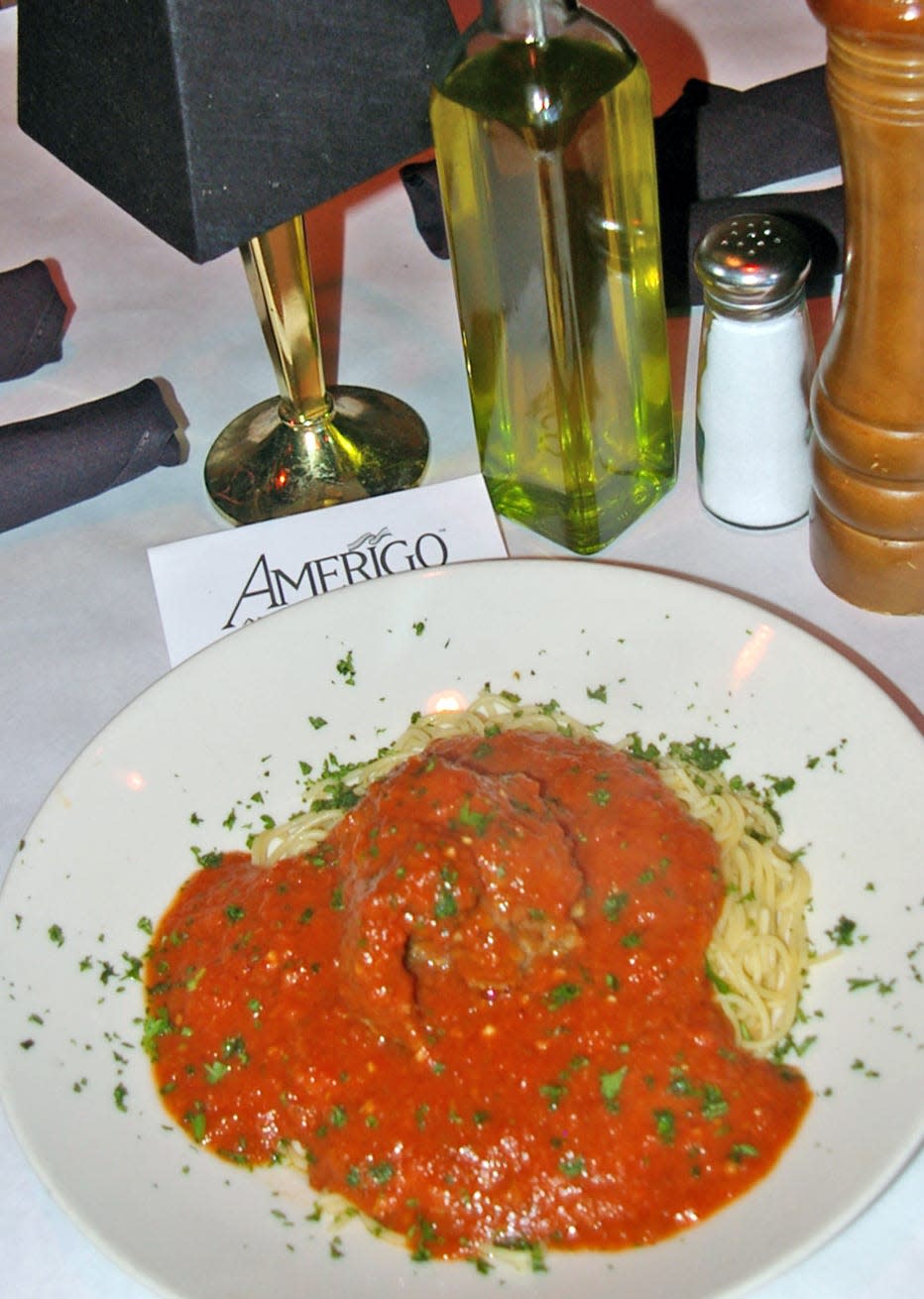 Amerigo prepares homemade spaghetti sauce for their homemade pasta.