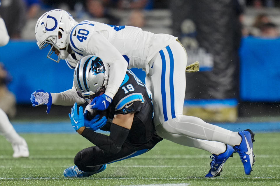 Carolina Panthers wide receiver Adam Thielen is tackled by Indianapolis Colts cornerback Jaylon Jones during the second half of an NFL football game Sunday, Nov. 5, 2023, in Charlotte, N.C. (AP Photo/Rusty Jones)