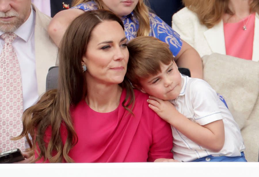 FILE – Prince Louis leans on Kate, Duchess of Cambridge, during the Platinum Jubilee Pageant held outside Buckingham Palace, in London, Sunday June 5, 2022, on the last of four days of celebrations to mark the Platinum Jubilee. (Chris Jackson/Pool Photo via AP, File)