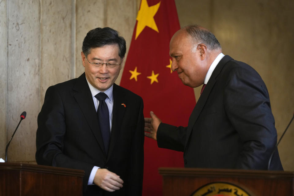 Egyptian Foreign Minister Sameh Shoukry, right, greets his Chinese counterpart, Qin Gang, following their press conference at the foreign ministry headquarters in Cairo, Egypt, Sunday, Jan. 15, 2023. (AP Photo/Amr Nabil)