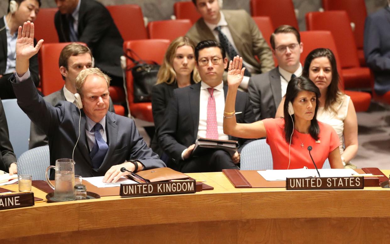 British Ambassador to the United Nations Matthew Rycroft, left, and American Ambassador to the United Nations Nikki Haley vote during a Security Council meeting on a new sanctions resolution that would increase economic pressure on North Korea to return to negotiations on its missile program. - Copyright 2017 The Associated Press. All rights reserved.