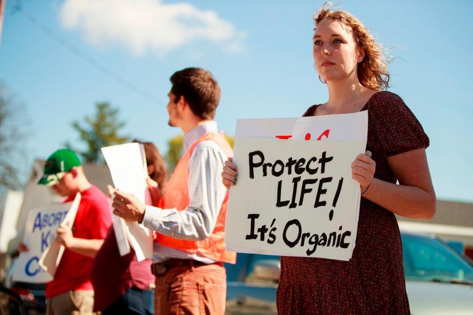 PHOTO: A woman holds a sign during an abortion rally in Bloomington, Indiana, Oct. 2, 2022. (Jeremy Hogan/SOPA Images/LightRocket via Getty Images)