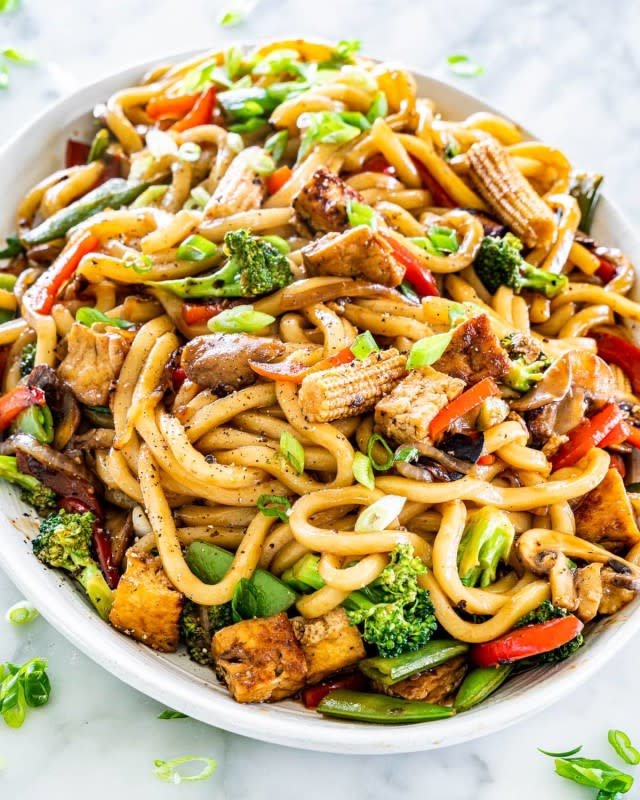 <p>Jo Cooks</p><p>Spicy, succulent udon noodles made with tofu and an array of bright veggies. An easy and addictive meal!</p><p><strong>Get the recipe: <a href="https://www.jocooks.com/recipes/tofu-drunken-noodles/" rel="nofollow noopener" target="_blank" data-ylk="slk:Tofu Drunken Noodles;elm:context_link;itc:0;sec:content-canvas" class="link "><em>Tofu Drunken Noodles</em></a></strong></p>