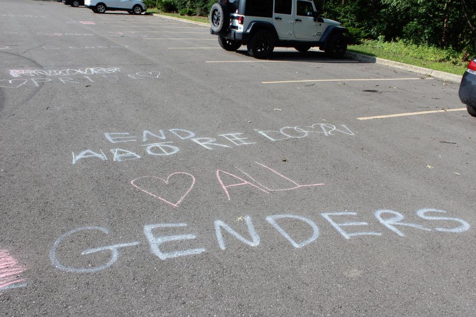 FlexTech High School students turn the message "End Abortion 2 Genders" into "End Hatred Love All Genders" on Tuesday, Aug. 29, 2023