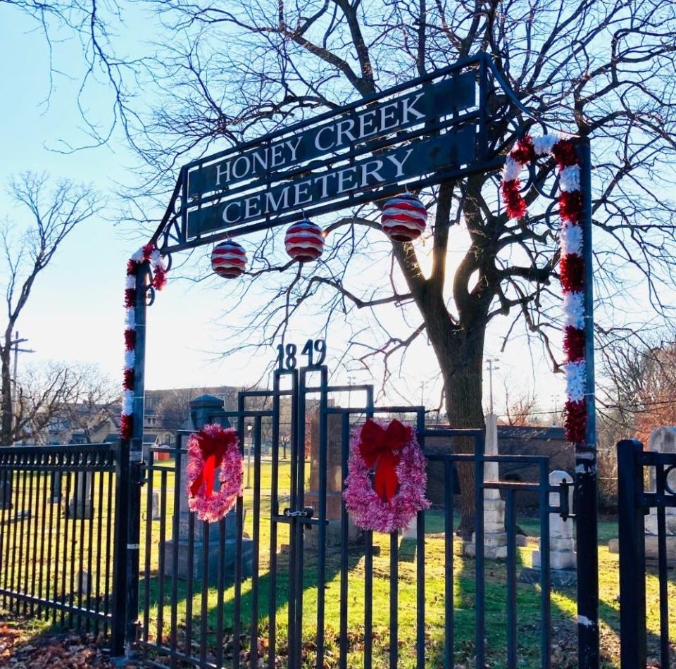The entrance at Honey Creek Cemetery in West Allis is adorned with holiday decorations.