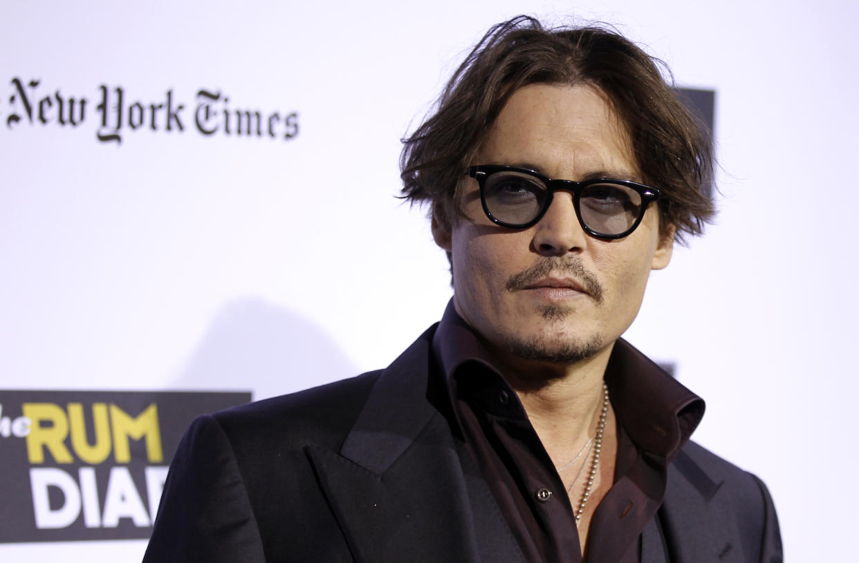 Cast member Johnny Depp arrives at the premiere of "The Rum Diary" in Los Angeles, Thursday, Oct. 13, 2011.  "The Rum Diary" opens in theaters Oct. 28, 2011. (AP Photo/Matt Sayles)