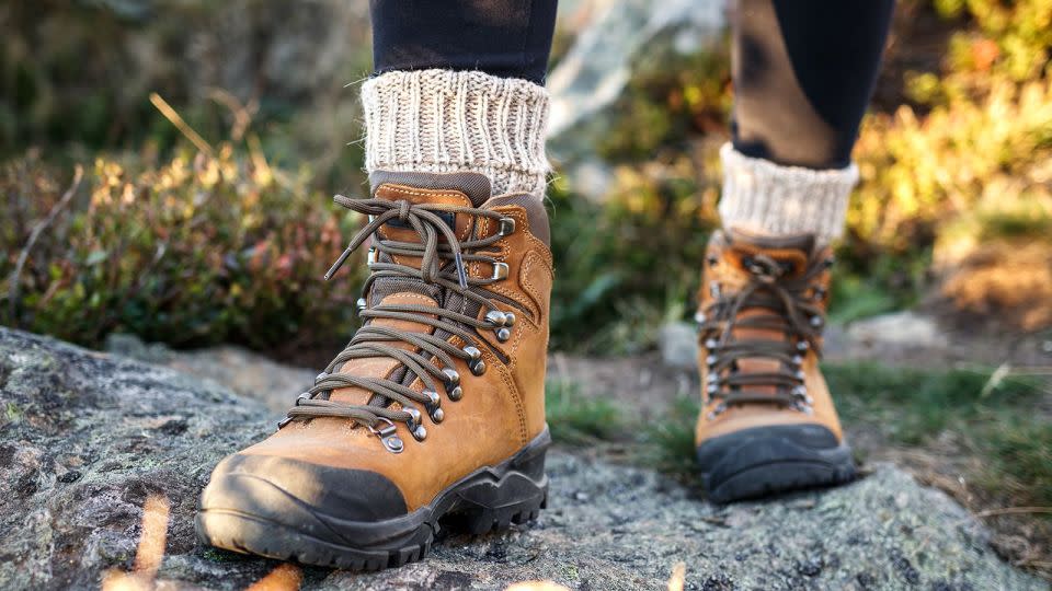 Tucking the bottoms of your pants into your socks is one way to prevent tick bites when you're hiking out in the wild. - Zbynek Pospisil/iStockphoto/Getty Images