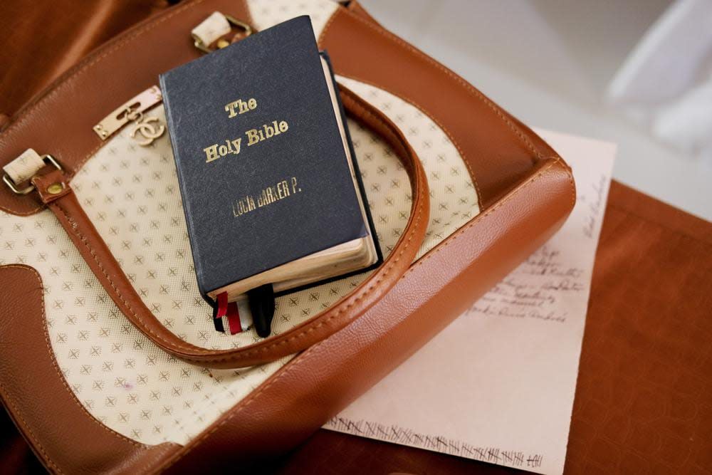 A Bible belonging to Lucia Barker, 83, a member of the choir at First Baptist Church on Colombia’s San Andres Island, rests on a purse on Sunday, Aug. 21, 2022. The church’s founder, Philip Beekman Livingston Jr., taught English-speaking former slaves and their descendants how to read using the Bible. (AP Photo/Luis Andres Henao)
