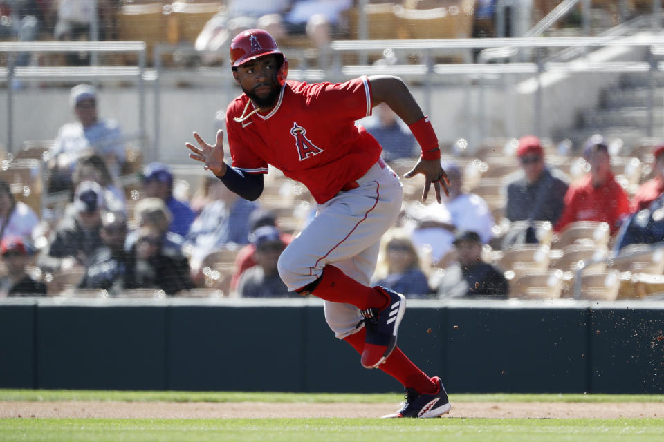 Los Angeles Angels' Jo Adell runs towards second base before getting out on a force out by Brian Goodwin during the first inning of a spring training baseball game against the Los Angeles Dodgers, Wednesday, Feb. 26, 2020, in Glendale, Ariz. (AP Photo/Gregory Bull)