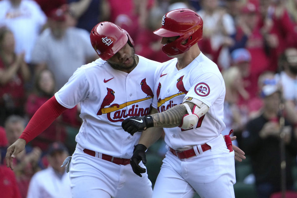 St. Louis Cardinals' Tyler O'Neill, right, is congratulated by teammate Willson Contreras after hitting a two-run home run during the third inning of an opening day baseball game against the Toronto Blue Jays Thursday, March 30, 2023, in St. Louis. (AP Photo/Jeff Roberson)