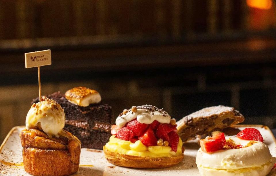 Meat Market's dessert sampler, complete with cookies, cheesecake, a cinnamon roll and a torched honey marshmallow, has been called a `love at first sight’ experience.