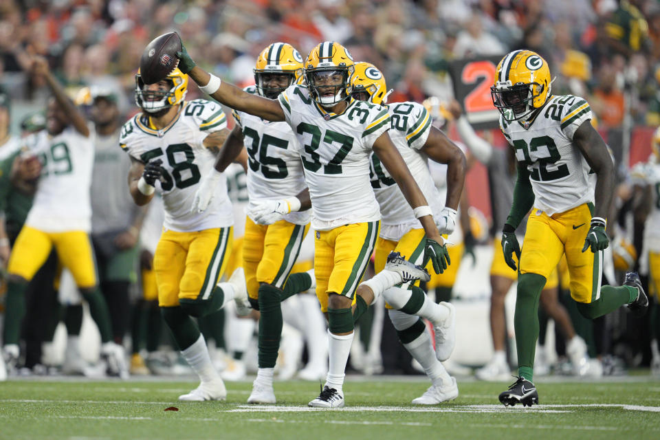 Green Bay Packers cornerback Carrington Valentine (37) celebrates after intercepting a pass during the first half of a preseason NFL football game against the Cincinnati Bengals Friday, Aug. 11, 2023, in Cincinnati. (AP Photo/Jeff Dean)