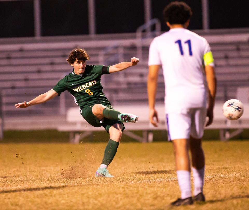 Forest Wildcats Brantley Wigginton (8) kicks a penalty kick. The Belleview Rattlers and the Forest Wildcats played in the MCIAC Boys Soccer Playoffs at Belleview High School in Beleview , FL on Thursday, January 11, 2024. Forest won 3-0. [Doug Engle/Ocala Star Banner]