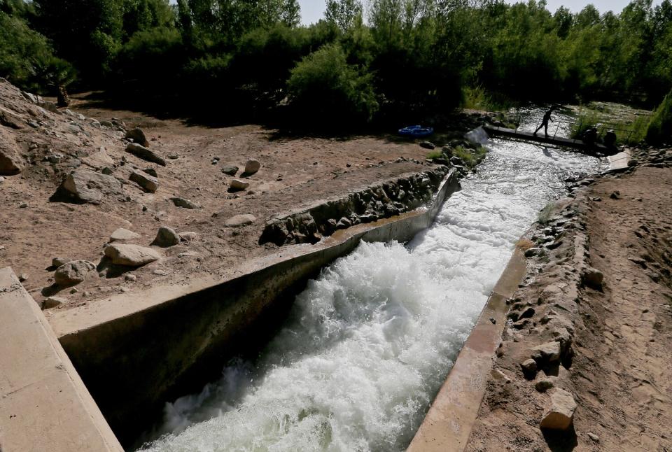 Water is released from a canal into a stretch of the Colorado River Delta in Mexico.