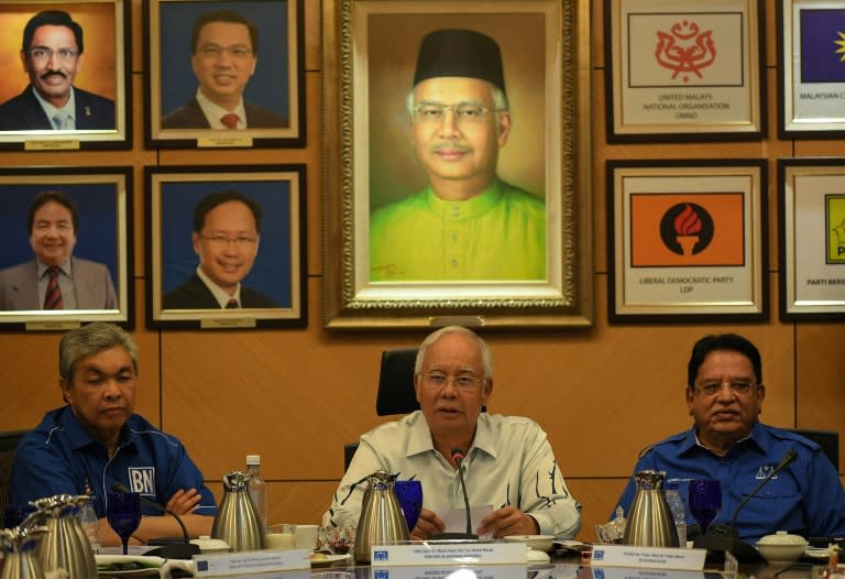 Malaysia's Prime Minister Najib Razak (C) speaks during a press conference in Kuala Lumpur on March 29, 2017