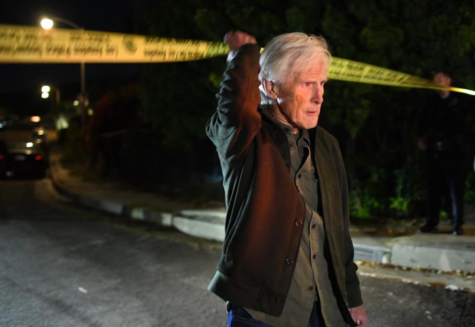 Keith Morrison walking under police tape ]