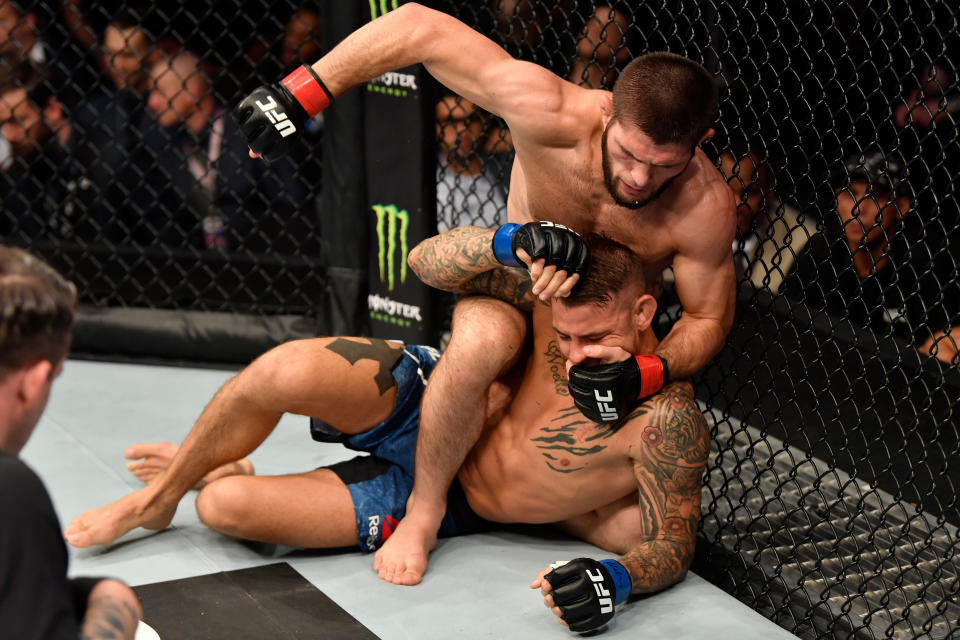 ABU DHABI, UNITED ARAB EMIRATES - SEPTEMBER 07:  Khabib Nurmagomedov of Russia (top) punches Dustin Poirier in their lightweight championship bout during UFC 242 at The Arena on September 7, 2019 in Yas Island, Abu Dhabi, United Arab Emirates. (Photo by Jeff Bottari/Zuffa LLC/Zuffa LLC via Getty Images)