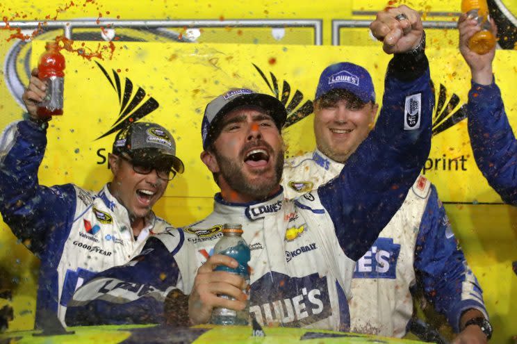 Jimmie Johnson celebrates winning his record-tying seventh title. (Getty Images)