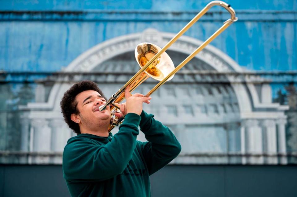 Sabien Kinchlow-McConnaughey, a senior from Bethel High School, plays the trombone in downtown Tacoma, Wash., on Saturday, Jan. 22, 2022. The Honors Performance Series, a performing arts organization, recently offered Sabien Kinchlow-McConnaughey an opportunity to play with other young musicians in early February at Carnegie Hall in New York City.
