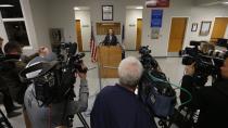 Virginia Department of Corrections spokesperson, Lisa Kinney, at podium, announces the execution of Ricky Gray at the Greensville Correctional Center in Jarratt, Va., Wednesday, Jan. 18, 2017. Gray who was convicted of killing a couple and their two young daughters in their Virginia home on New Year's Day 2006 was put to death Wednesday. (AP Photo/Steve Helber)