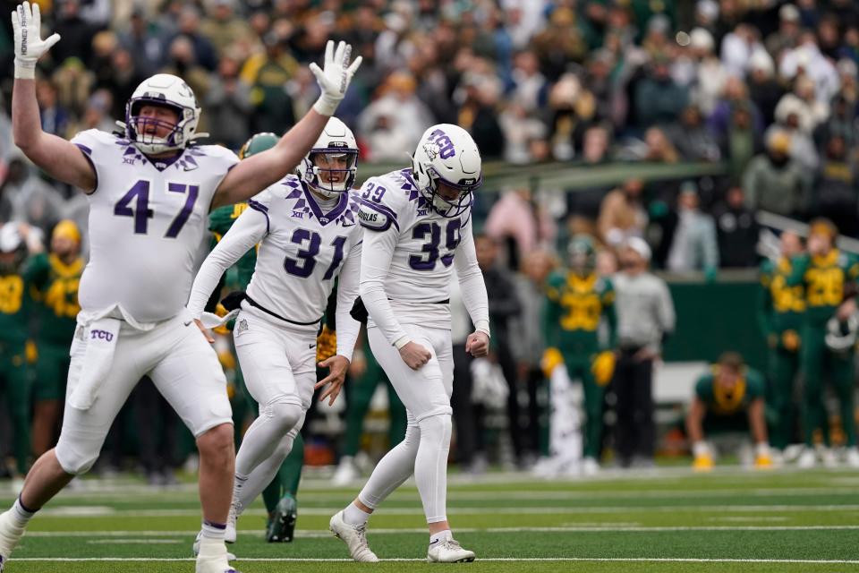 TCU place kicker Griffin Kell (39) celebrates with teammates Jake Boozer (47) and Jordy Sandy (31) after hitting a field goal on the last play against Baylor.