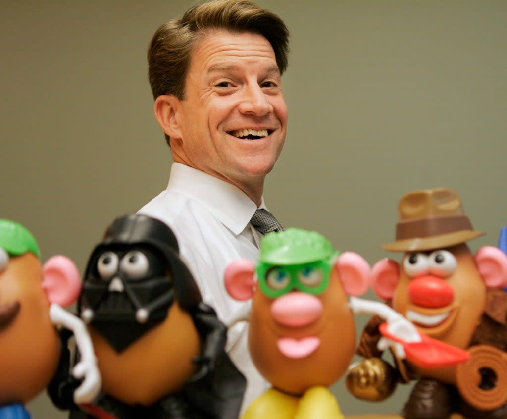 In this 2008 file photo, Brian Goldner stands next to some toy figures at Hasbro’s headquarters, in Pawtucket, Rhode Island  (AP)