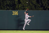 Houston Astros center fielder Jake Meyers makes a leaping catch on a pop fly by Los Angeles Angels' Kean Wong during the sixth inning of a baseball game Tuesday, Sept. 21, 2021, in Anaheim, Calif. (AP Photo/Marcio Jose Sanchez)