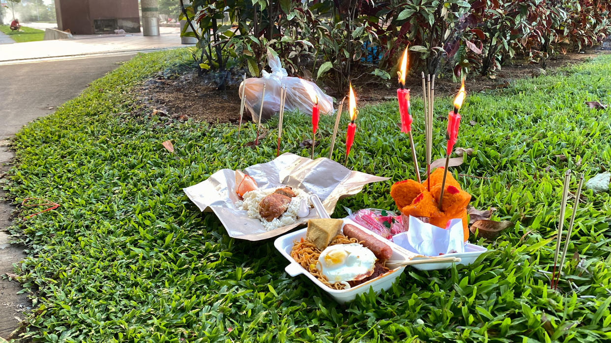 Offerings by the pavement in Singapore during the Ghost Month. (Photo: Getty Images)